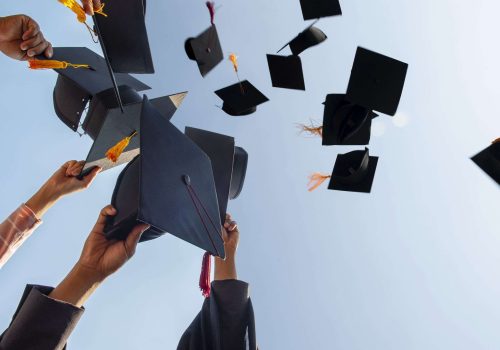 cropped-hands-of-people-throwing-mortarboards-royalty-free-image-1649367603